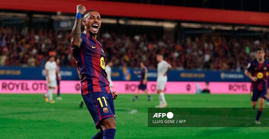 Barcelona's Brazilian forward #11 Raphinha celebrates scoring his team's fourth goal during the Spanish league football match between FC Barcelona and Valencia CF at Johan Cruyff Stadium in Barcelona, on September 14, 2025. - AFP