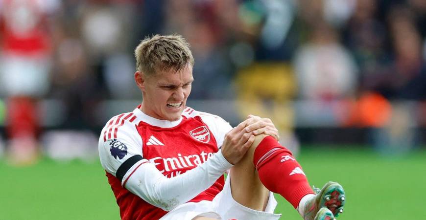 Martin Odegaard reacts after sustaining an injury Action Images via Reuters/Peter Cziborra