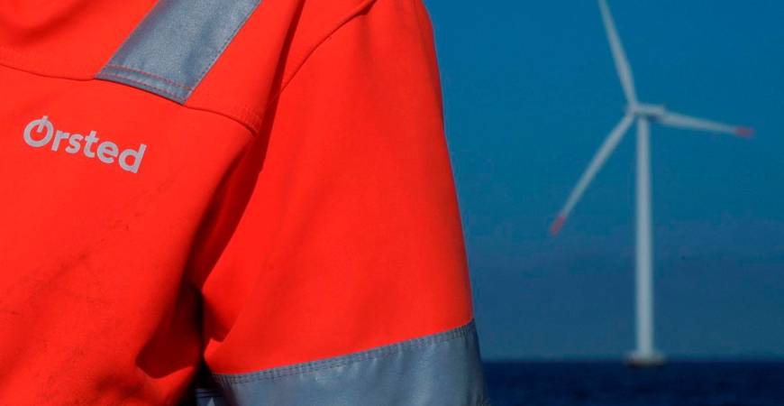 FILE PHOTO: The logo for Orsted can be seen on the jacket worn by an employee as he talks to journalists during a visit to the offshore wind farm near Nysted, Denmark, September 4, 2023. REUTERS/Tom Little/File Photo/File Photo
