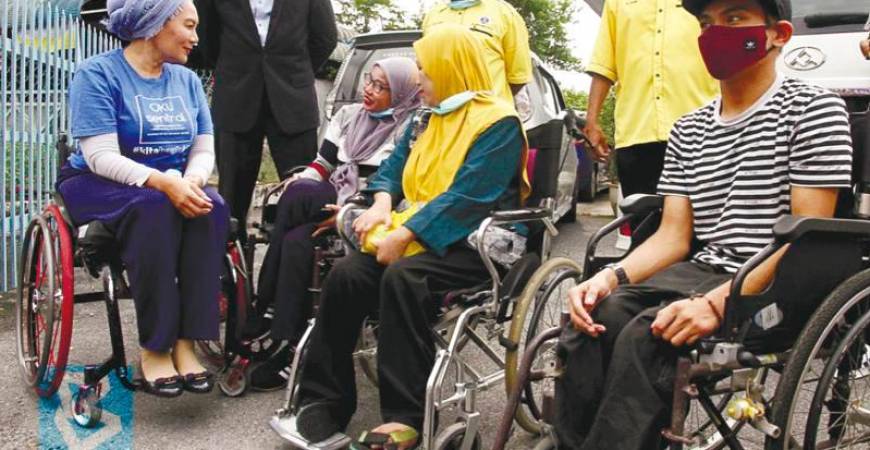 OKU Sentral president Senator Datuk Ras Adiba Radzi (left) with other persons with disabilities at an event recently. – BERNAMAPIC