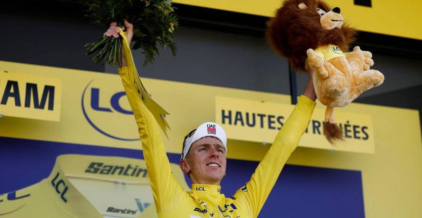 UAE Team Emirates XRG’s Tadej Pogacar celebrates on the podium wearing the yellow jersey after winning stage 12 - REUTERS