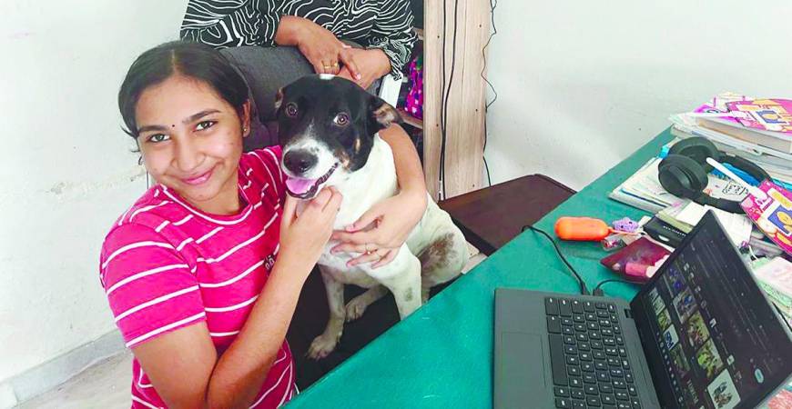 Thaynhiskha enjoys her digital classes, seen here at home with mother Deepa, where she rests in between her lessons.