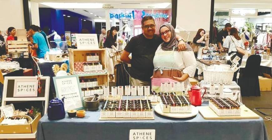 Faten with her husband Azizi at their pop-up store to promote Athene Spices in Publika last year; and (below) with her products. – Courtesy of Faten Rafie