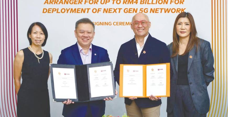 From feft: Denise Wong, Chu, Heang Tuck and Tsang at the signing ceremony.