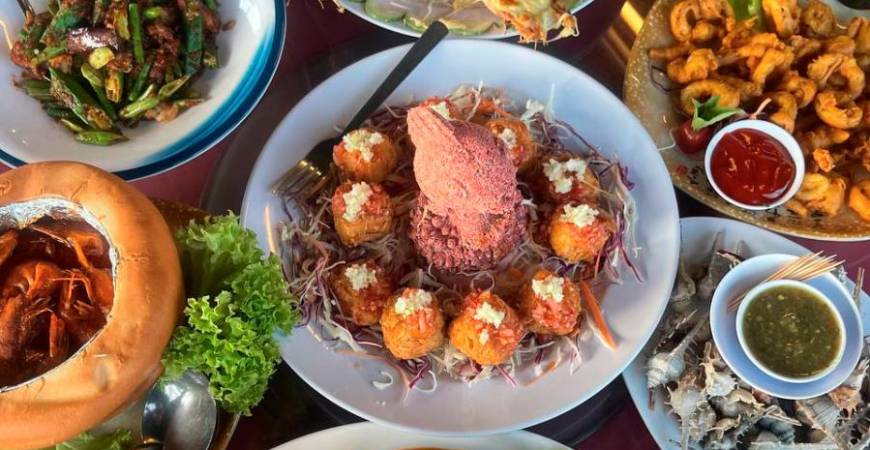 Prawn Village has a feast of local seafood favourites, including cheesy tiger prawns, sour &amp; spicy crab, yam ring and more, perfect for group sharing. – PICS BY YASMINZULRAEZ/THESUN