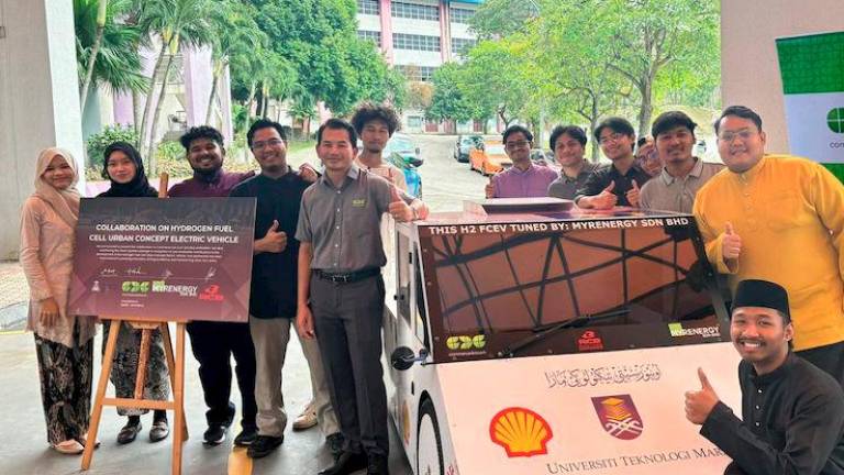 Hafidz Bin Ahmad Zehnun, VP of Corporate Planning &amp; Communication, at CDC (center), with the UiTM team and their hydrogen-powered vehicle at the flag-off in UiTM Shah Alam for Shell Eco-Marathon 2025 in Doha, Qatar