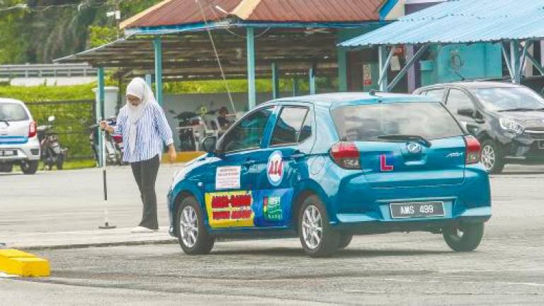 To alleviate the shortage, the government has temporarily allowed non-SPM holders to apply to be trained as driving instructors. – AMIRUL SYAFIQ/THESUN