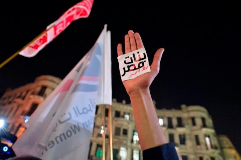 An Egyptian protester holds up his hand with a slogan reading in Arabic: “Egyptian girls are a red line” during a 2013 demonstration in Cairo against sexual harassment. — AFP