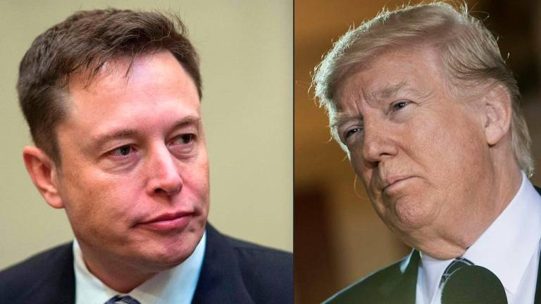 This combination of pictures created on May 31, 2017 shows a file photo taken on January 23, 2017 showing SpaceX CEO Elon Musk listening to US President Donald Trump speak during a meeting with business leaders in the Roosevelt Room at the White House in Washington, DC, on January 23, 2017. - AFP pic