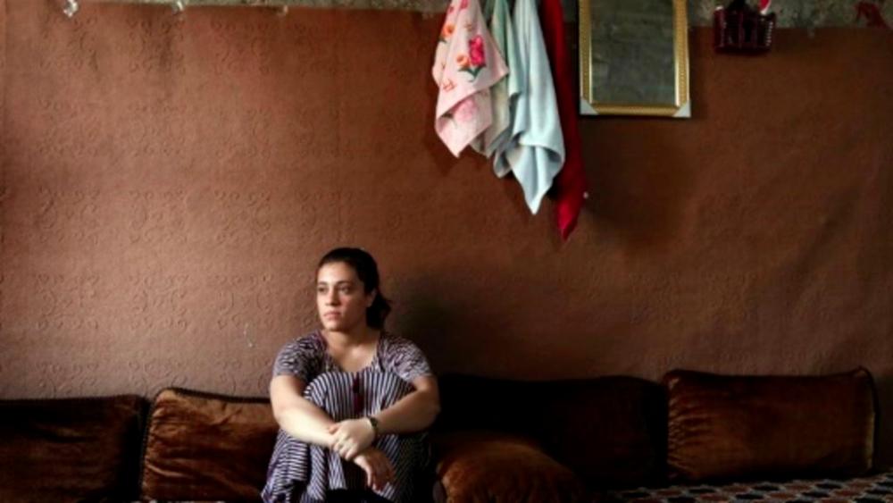 Yazidi teenager Jihan Qassem faced an impossible choice after being freed from years as a hostage of the Islamic State group, abandon her three young children fathered by a jihadist fighter or risk being ostracised by her community Yazidi teenager Jihan Qassem faced an impossible choice after being freed from years as a hostage of the Islamic State group, abandon her three young children fathered by a jihadist fighter or risk being ostracised by her community. — AFP