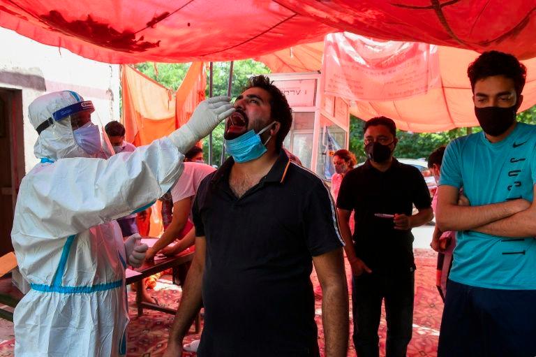 A man is tested for coronavirus in Ghaziabad, India. — AFP