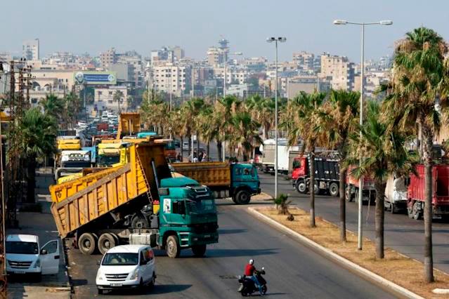 Truck drivers block roads in Beirut to protest fuel shortages due to Lebanon’s deepening economic crisis. — AFP
