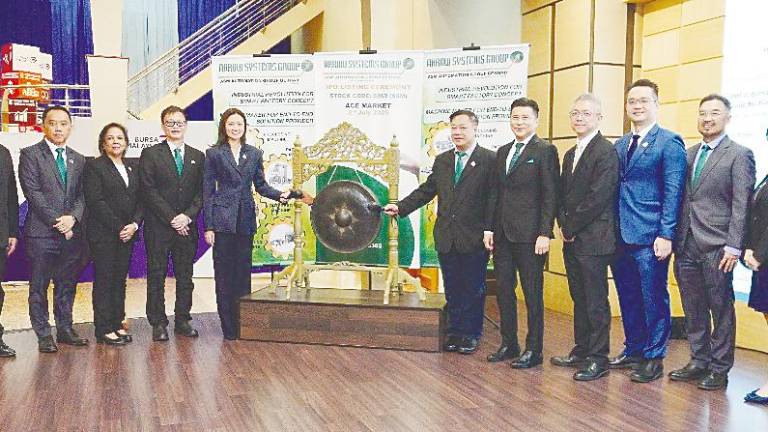 From left: ASM Automation non-executive director Datuk Dr Thian Boon Chung; Khoo; ASM Automation executive directors Kamalam Kurup Krishnan and Leong Weng Khin; non-executive chairperson Tengku Faizwa Tengku Razif; Chan; Tan; M&amp;A Equity Holdings corporate finance head Gary Ting and corporate finance deputy head Danny Wong; and ASM Automation non-executive directors Woo Ah Kek and Jolene Lai Ooi Yoke at the listing ceremony.