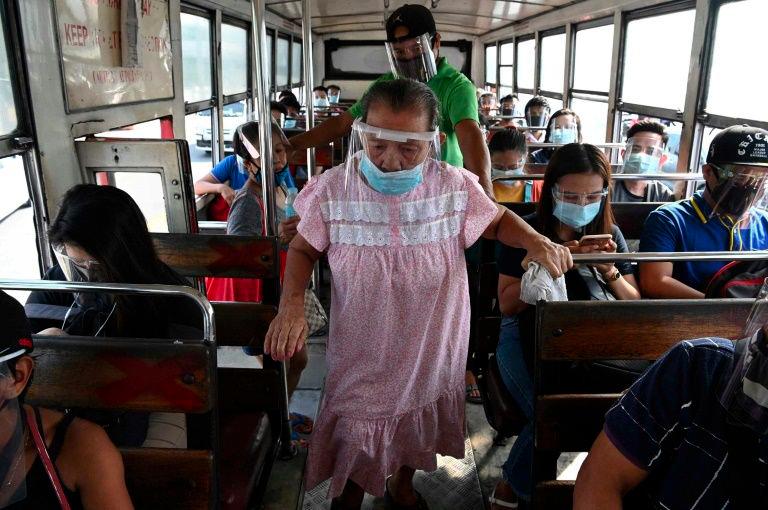 It is now compulsory to wear both face masks and plastic shields in indoor public spaces and on public transport in the Philippines. — AFP