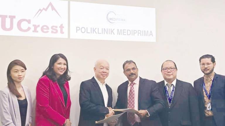 From left: UCrest assistant director Evelyn Liew, digital health director Viva Shaik, Eg, Dr Anbalagan, Mediaprima Healthcare general manager Jeffrey Lam and assistant general manager Dr Mohd Aidid Rizal at the signing ceremony.