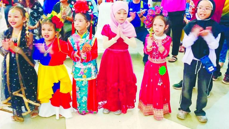 Some of the joyous children dressed in vibrant ethnic costumes at the event. – P. CHANDRA SAGARAN/THESUN