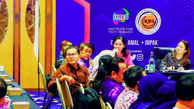 Yeoh listening to a participant during the roundtable conference yesterday at the Youth and Sports Ministry in Putrajaya. – ADAM AMIR HAMZAH/THESUN