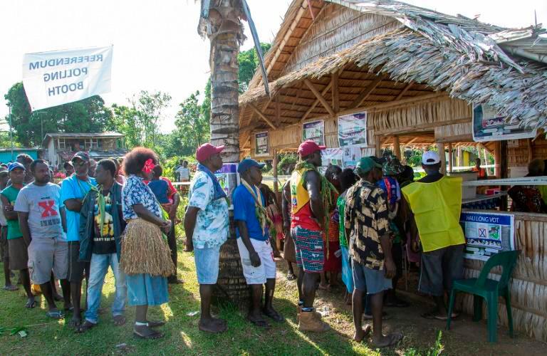People queue to vote at a polling station in the capital Buka in an historical independence vote on November 25, 2019. — AFP