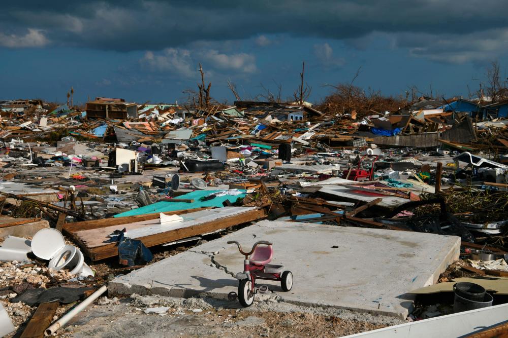 A child's bicycle is seen in a destroyed neighborhood in the wake of Hurricane Dorian in Marsh Harbour, Great Abaco, Bahamas, September 7, 2019. - Reuters