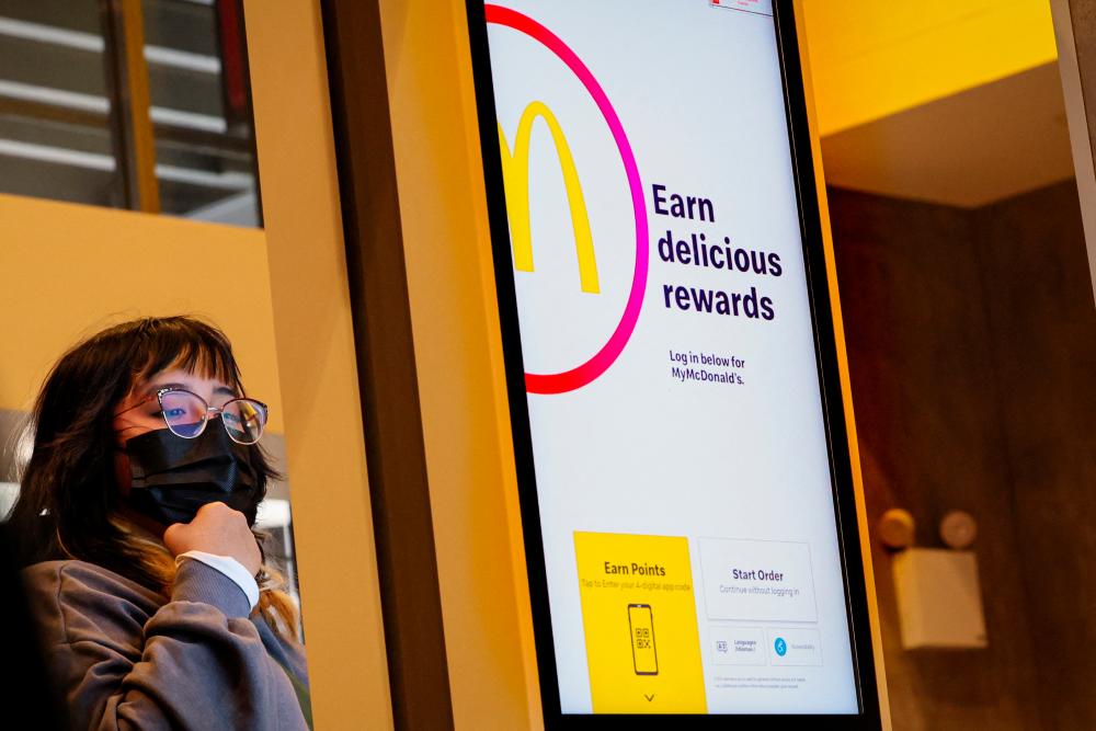 A customer entering an order into a kiosk at a McDonald’s in New York City. McDonald’s will open about 7,000 stores in its international developmental licensed markets, which include countries such as China, India, Japan and Brazil. – Reuterspic
