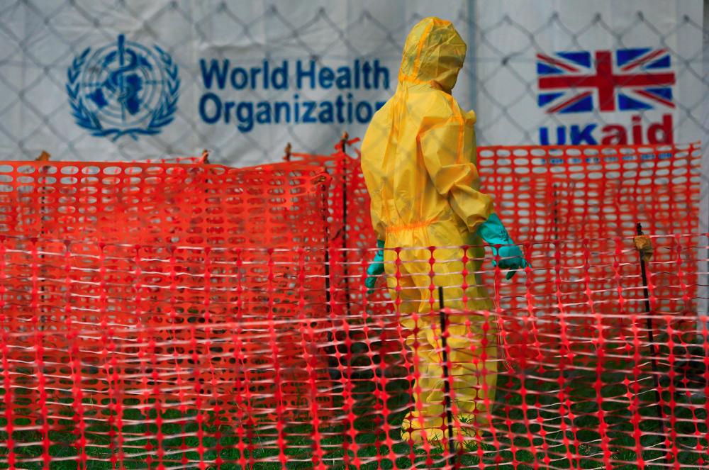 A person dressed in ebola protective apparel is seen inside an ebola care facility at the Bwera general hospital near the border with the Democratic Republic of Congo in Bwera, Uganda, June 14, 2019. - Reuters