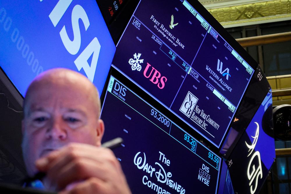 File picture of a trader working on the floor of the New York Stock Exchange. – Reuterspic