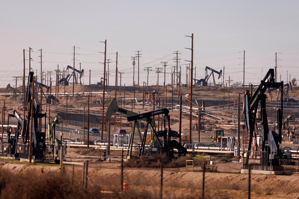 Oil derricks are seen at the Kern River oil fields, in Bakersfield, California on Jan 24. – Reuterspic