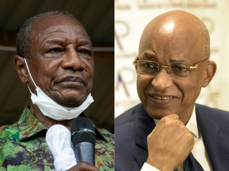 Guinea’s President Alpha Conde, left, is seeking to stave off a challenge from his old political opponent Cellou Dalein Diallo. — AFP