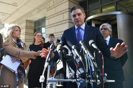 CNN White House correspondent Jim Acosta speaks outside the US District Court in Washington after a judge ordered his press credentials temporarily restored. — AFP