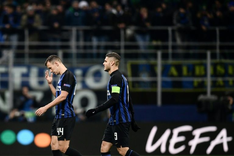 Inter Milan’s Ivan Perisic and Mauro Icardi (R) are downcast at the final whistle