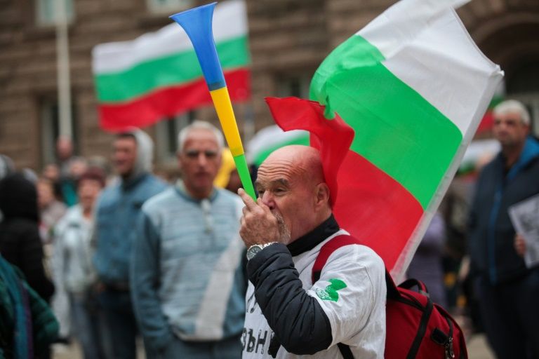 One of the demonstrators outside the parliament building in Sofia on Friday. — AFP
