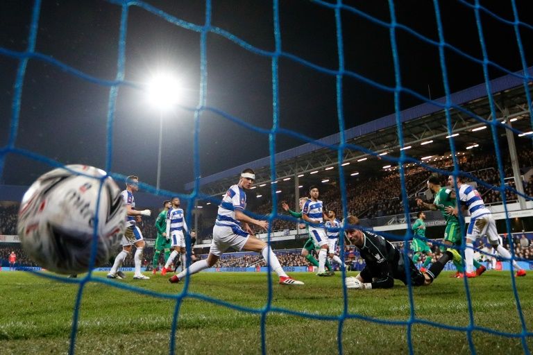 Hornets’ sting: Watford’s Etienne Capoue (3R) scores the goal that secured a 1-0 win away to QPR in the fifth round of the FA Cup on Friday. — AFP