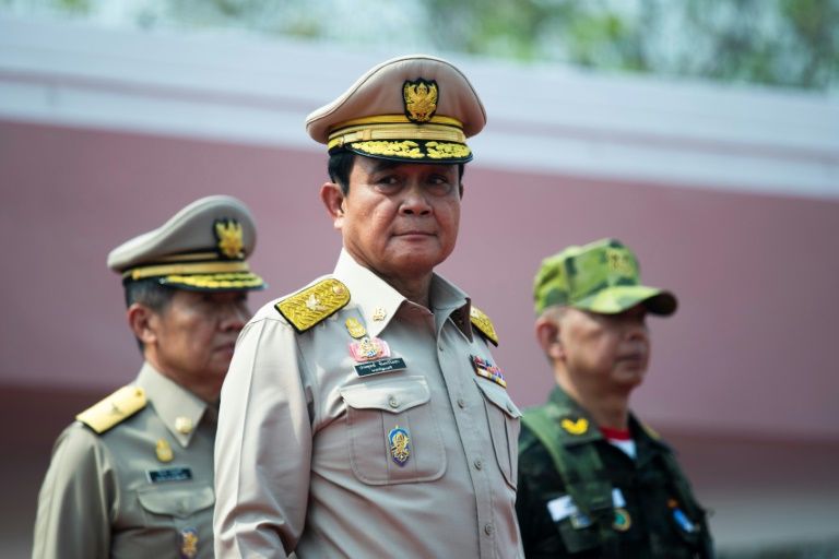 Thai Prime Minister Prayut Chan-O-Cha showed he still holds the reins after a week of drama in Thai politics as he appears with newly appointed army chief Apirat Kongsompong (right) at a military base in Lopburi. — AFP