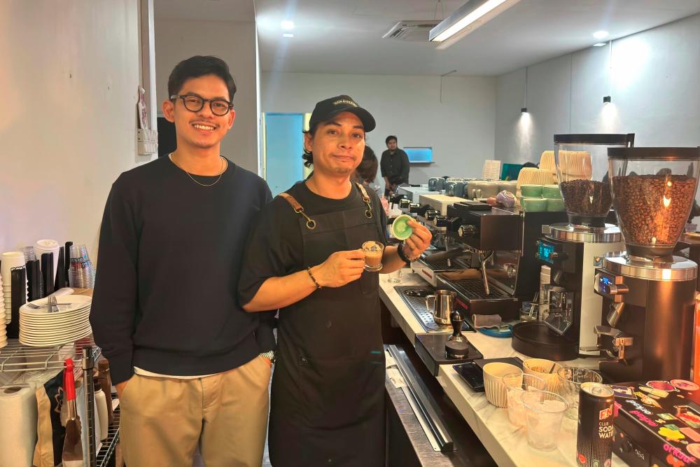 $!Izzat (left) and Hafiz run the cafe with passion to make customers happy.