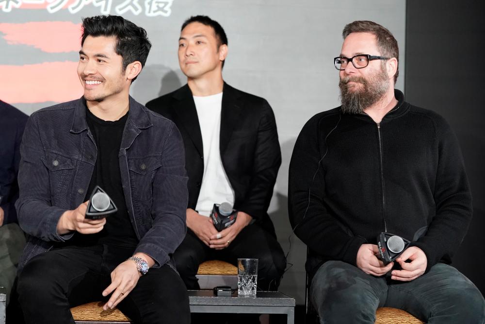 (L) Henry Golding and (R) Director Robert Schwentke attend the Snake Eyes start of Production in Japan event at the Hie-Jinja Shrine on January 10, 2020 in Tokyo, Japan. (Photo by Christopher Jue/Getty Images for Paramount Pictures)