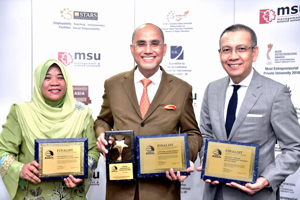 From left: MSU Vice Chancellor Prof Puan Sri Datuk Dr Junainah Abd Hamid, Mohd Shukri and MSU Endowment and Communication Senior Vice President Datuk Rosli Yusof with the awards received by MSU.