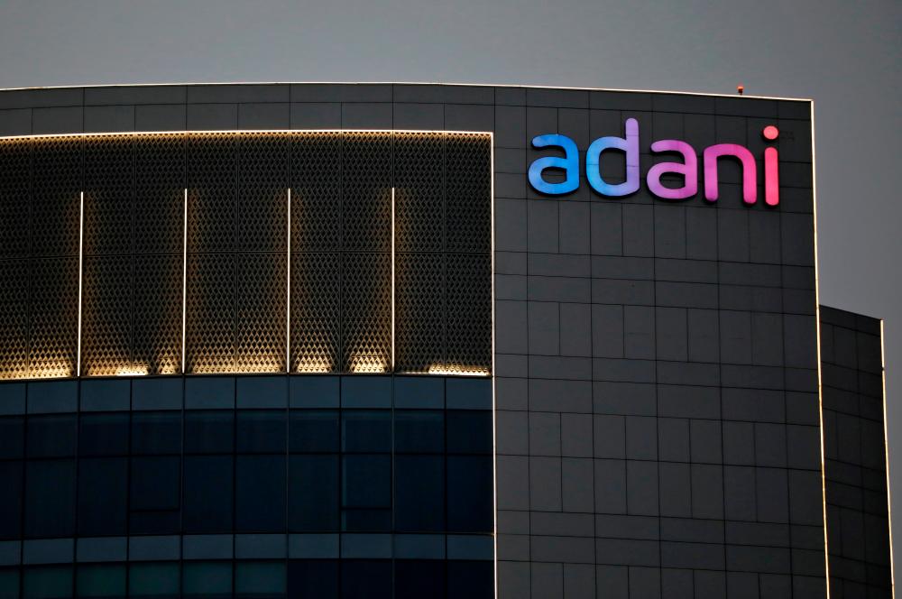 The logo of the Adani Group is seen on the facade of one of its buildings on the outskirts of Ahmedabad, India. – REUTERSPIX