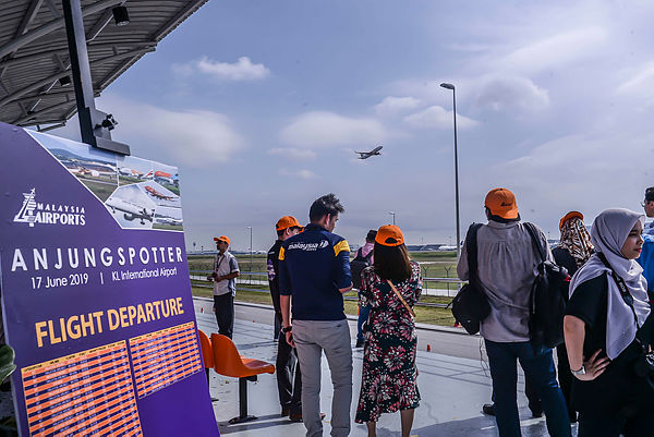 Observers capture photographs during the launch of the Anjung Spotter observation deck at Jalan Pekeliling, Sepang on June 17.