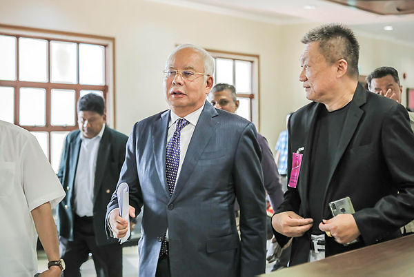 Filepix taken on Aug 19 shows former prime minister Datuk Seri Najib Abdul Razak while attending the trial of the SRC International case at the Kuala Lumpur Courts Complex. — Sunpix by Adib Rawi Yahya