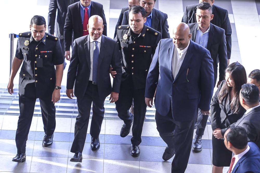 Arul Kanda arrives to be charged over the 1Malaysia Development Bhd (1MDB) audit report tampering case, on Dec 12, 2018. — Sunpix by Adib Rawi Yahya