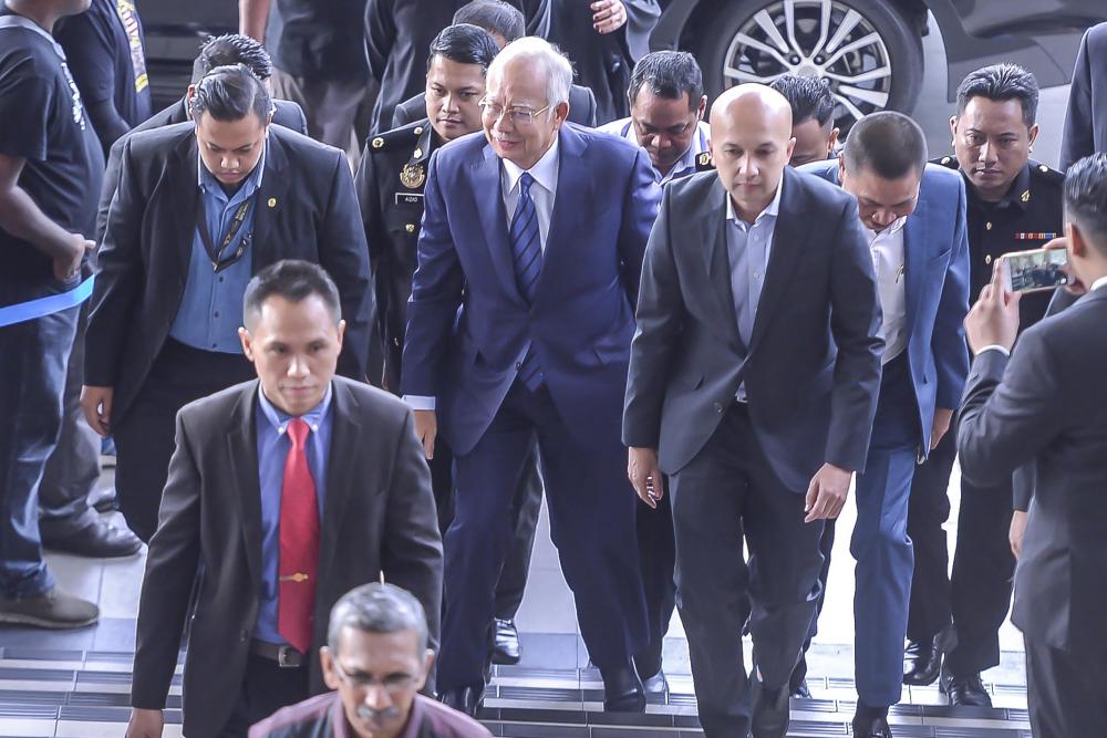 Former prime minister Datuk Seri Najib Razak arrives at Kuala Lumpur Sessions Court, on Dec 12, 2018. — Sunpix by Adib Rawi Yahya