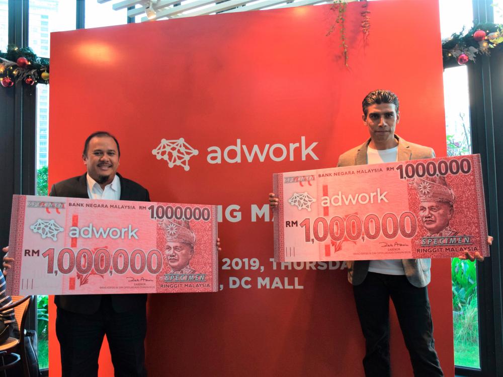 Zaky (left) and Kumaresh officiating the launch of Adwork.