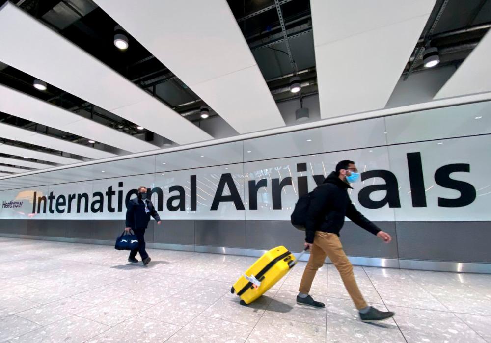 Travellers at Heathrow Airport, London, Britain, February 13, 2021. REUTERSPix