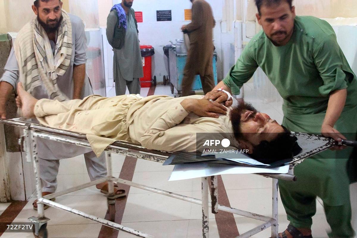 Volunteers carry an injured man to a hospital after an earthquake in Afghanistan's Jalalabad on September 1, 2025. Nine people died when a 6.0-magnitude earthquake and powerful aftershock rattled eastern Afghanistan, the provincial Nangarhar government said on September 1. - Aimal ZAHIR / AFP
