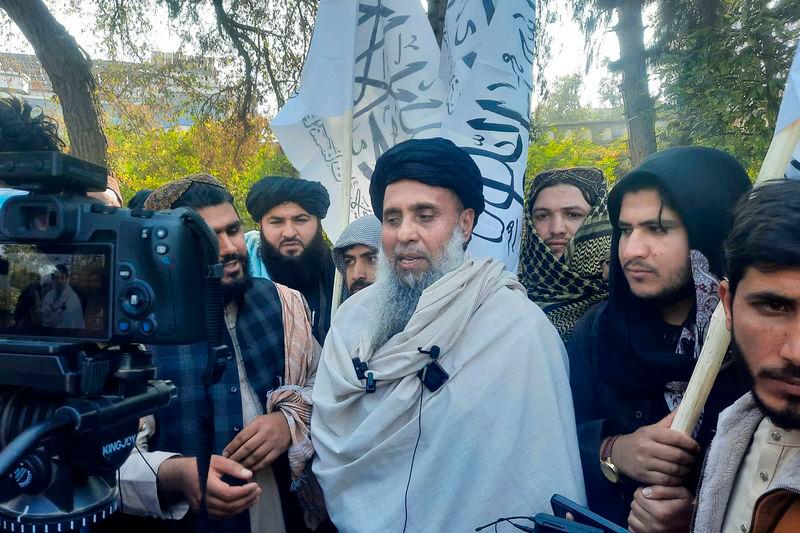 Afghan fighter Khan Mohammad (C) who was imprisoned in America, speaks to the media as he arrived in Jalalabad after he was released in exchange for American citizens - AFPpix