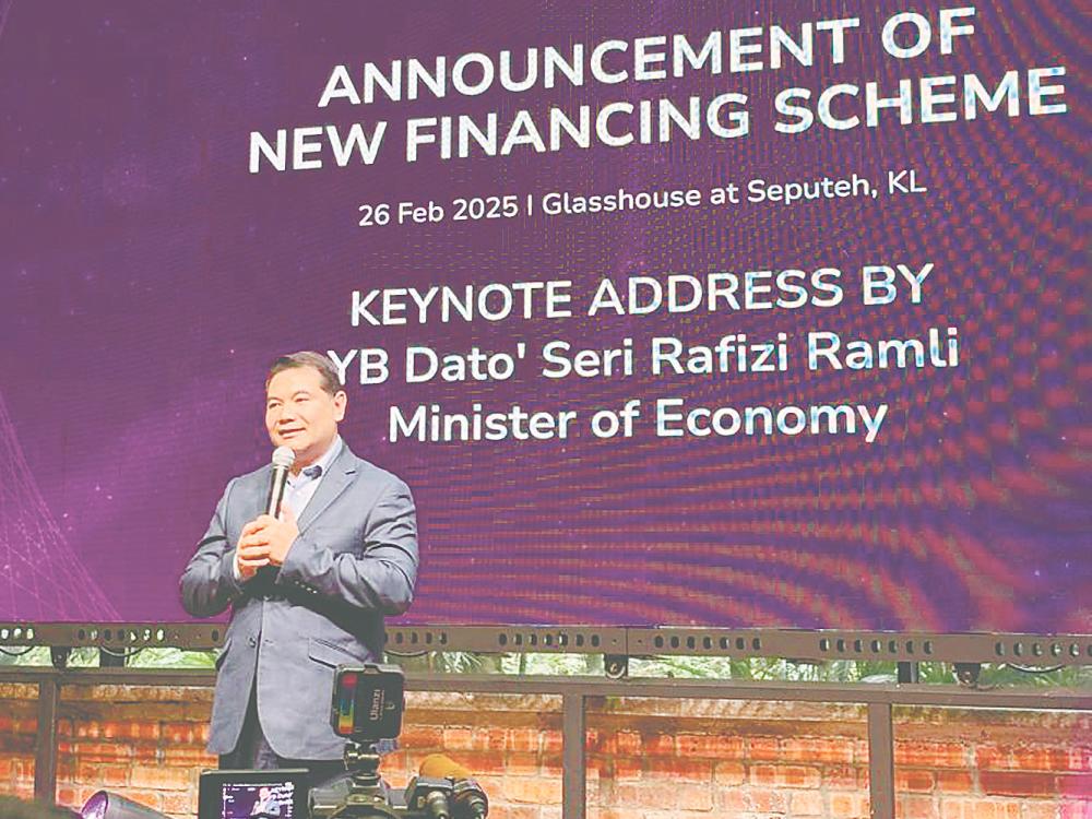 Rafizi announcing the tiered financing scheme yesterday.