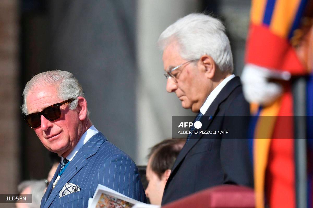 Charles, Prince of Wales (L) flanked by Italy's Republic President Sergio Mattarella attends the Canonization Mass for English John Henry Newman, Italian Giuseppina Vannini, Indian Maria Teresa Chiramel Mankidiyan, Brazilian Dulce Lopes Pontes, and Swiss Margarita Bays on October 13, 2019 In Saint Peter's square at the Vatican. - AFP