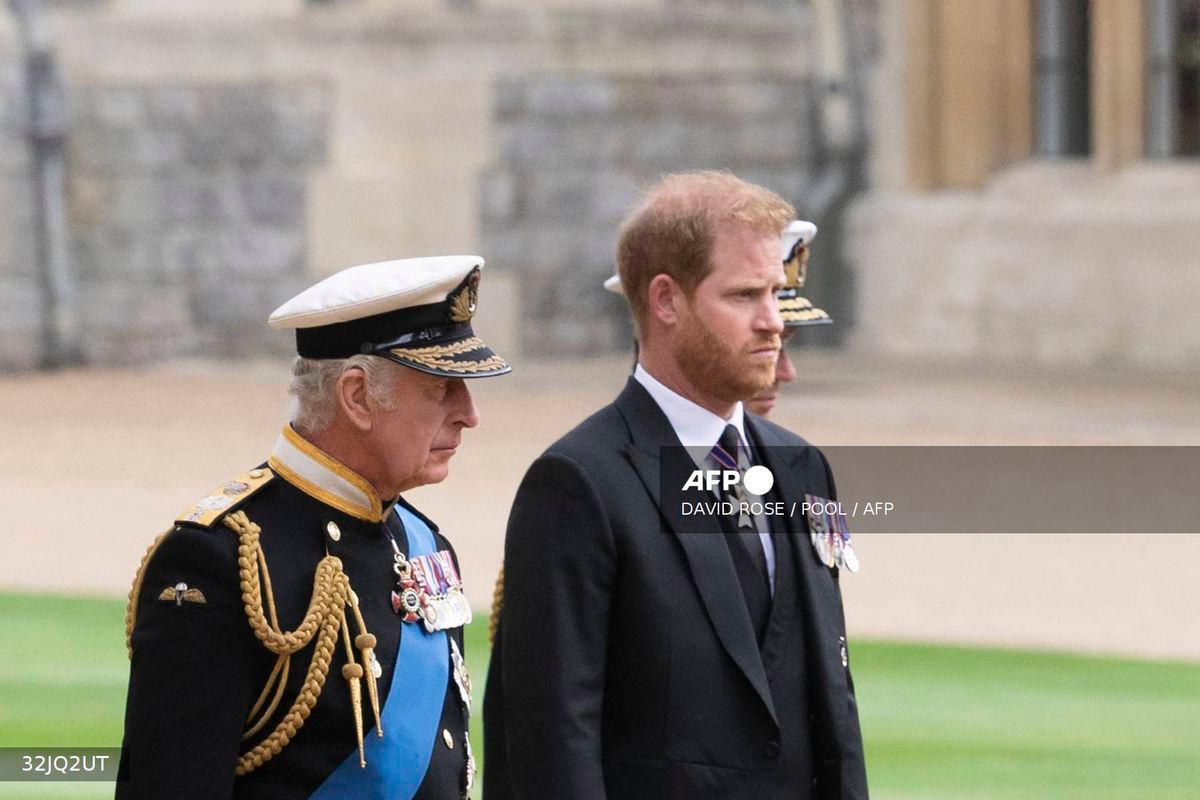 Britain's King Charles III (L) walks with his son Britain's Prince Harry, Duke of Sussex as they arrive at St George's Chapel inside Windsor Castle on September 19, 2022, ahead of the Committal Service for Britain's Queen Elizabeth II. - POOL via AFP