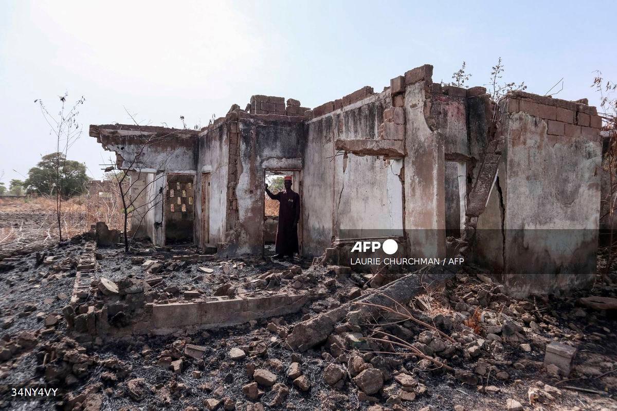 For representational purposes only - This photograph taken on March 31, 2024 shows Vice Principal Bature Sule surveying the wreckage of a dormitory destroyed by Boko Haram fighters at the Chibok Government Girls Secondary School in 2014. A decade since Nigeria’s most infamous mass abduction, almost 100 of the 276 girls seized from their school in Chibok by Boko Haram fighters are still thought to be in captivity.
