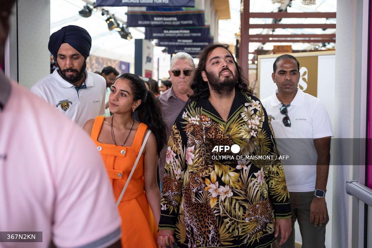 Billionaire tycoon and Chairman of Reliance Industries Mukesh Ambani’s son Anant Ambani (2R) and his wife Radhika Merchant (2L) arrive at the India house as part of the Paris 2024 Olympic Games in Paris, on July 30 2024. (Photo by Olympia DE MAISMONT / AFP)